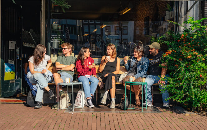 Group of friends chatting outside a cafe