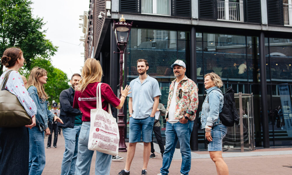 Tourists on a guided walking tour in Amsterdam