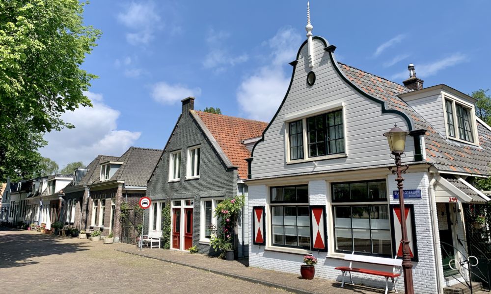 Traditional Dutch houses with decorative facades. Colourful buildings in a Dutch village.