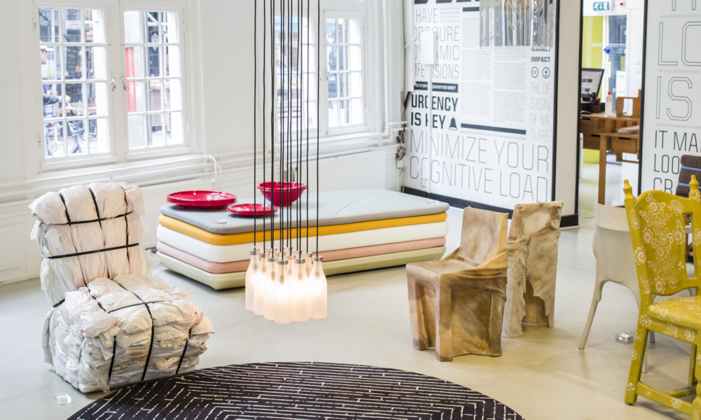 Contemporary chair and sofa in stylish room. Modern interior design.