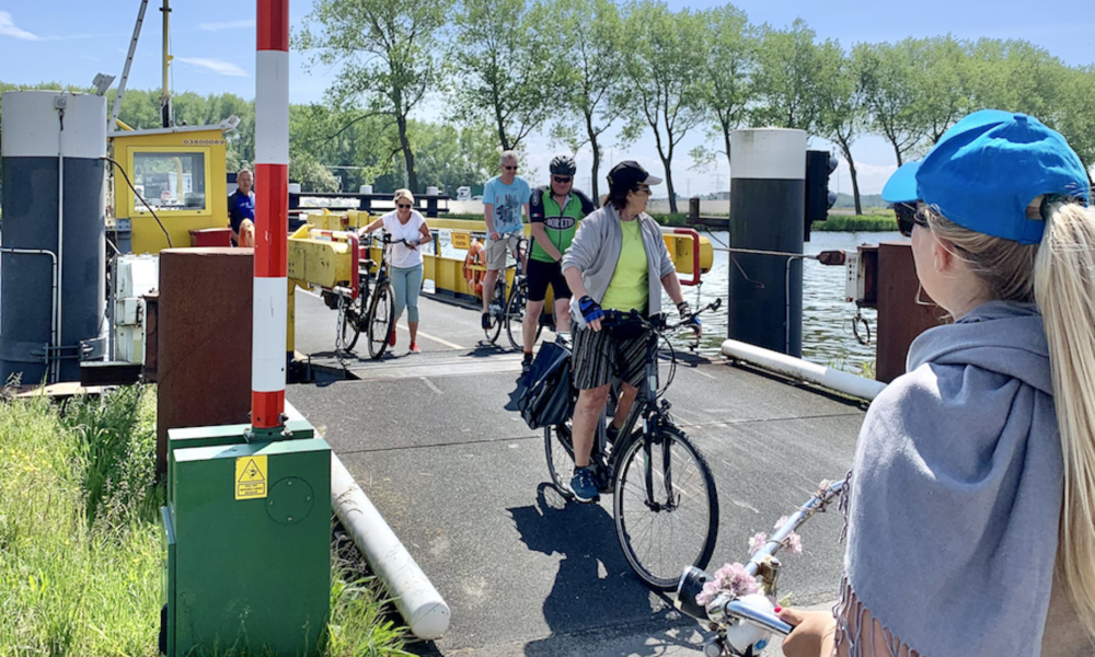 Cyclists on a ferry. Amsterdam city trips.