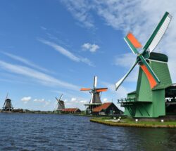 Traditional Dutch windmills on a lake. Classic Dutch scenery.
