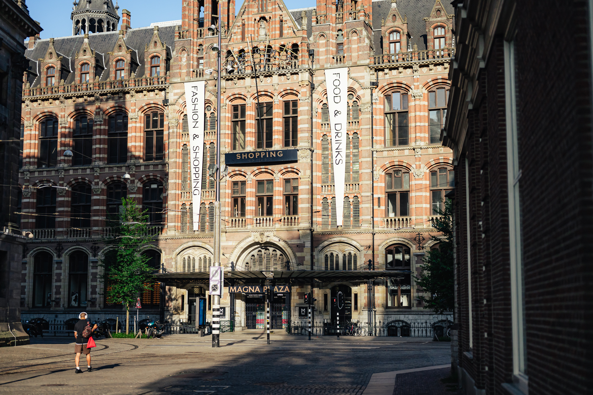 Beurs van Zocher building, a historic stock exchange. A woman walks by.
